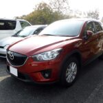 Klosz do reflektora lampy Mazda CX5 2011-2015 2 Mazda CX-5 pierwszej generacji KE 2014, widok od przodu – zdjęcie poglądowe